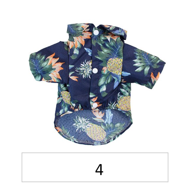 Front view of a navy tropical pet shirt with pineapple and floral print labeled 4