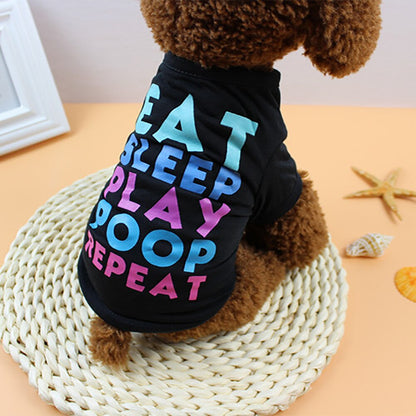 Brown dog wearing a black Eat Sleep Play Poop Repeat pet shirt viewed from the side and back