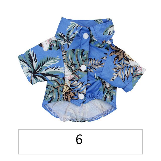 Front view of a blue tropical pet shirt with flowers and palm leaves labeled 6