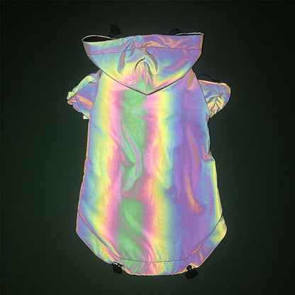Hooded dog jacket back view showing a bright rainbow reflective finish