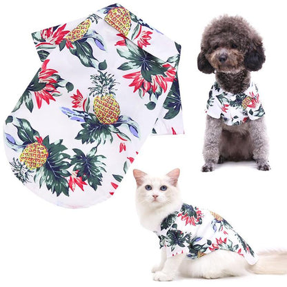 White tropical pet shirt shown alongside a dog and cat wearing it