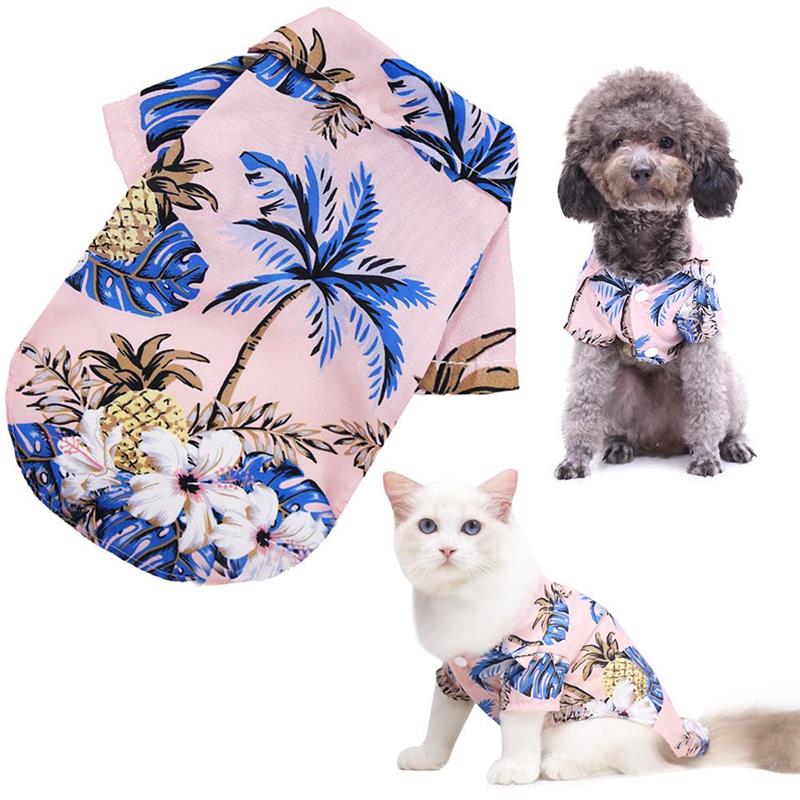 Pink tropical pet shirt shown alongside a dog and cat wearing it