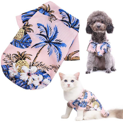 Pink tropical pet shirt shown alongside a dog and cat wearing it