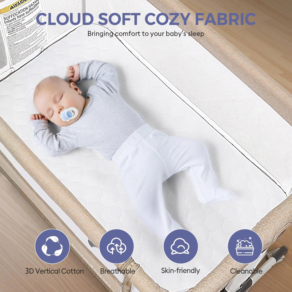 Baby resting in a beige bedside bassinet with white bedding, under a “Cloud Soft Cozy Fabric” heading.