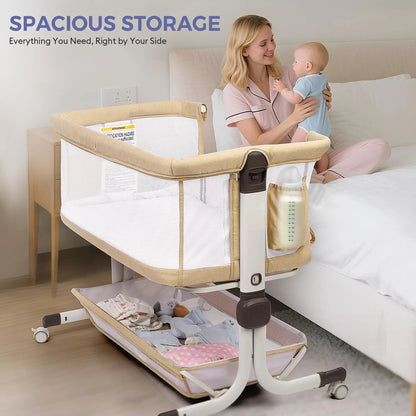 Mother holding a baby beside a beige bassinet with a side pocket and lower storage shelf.