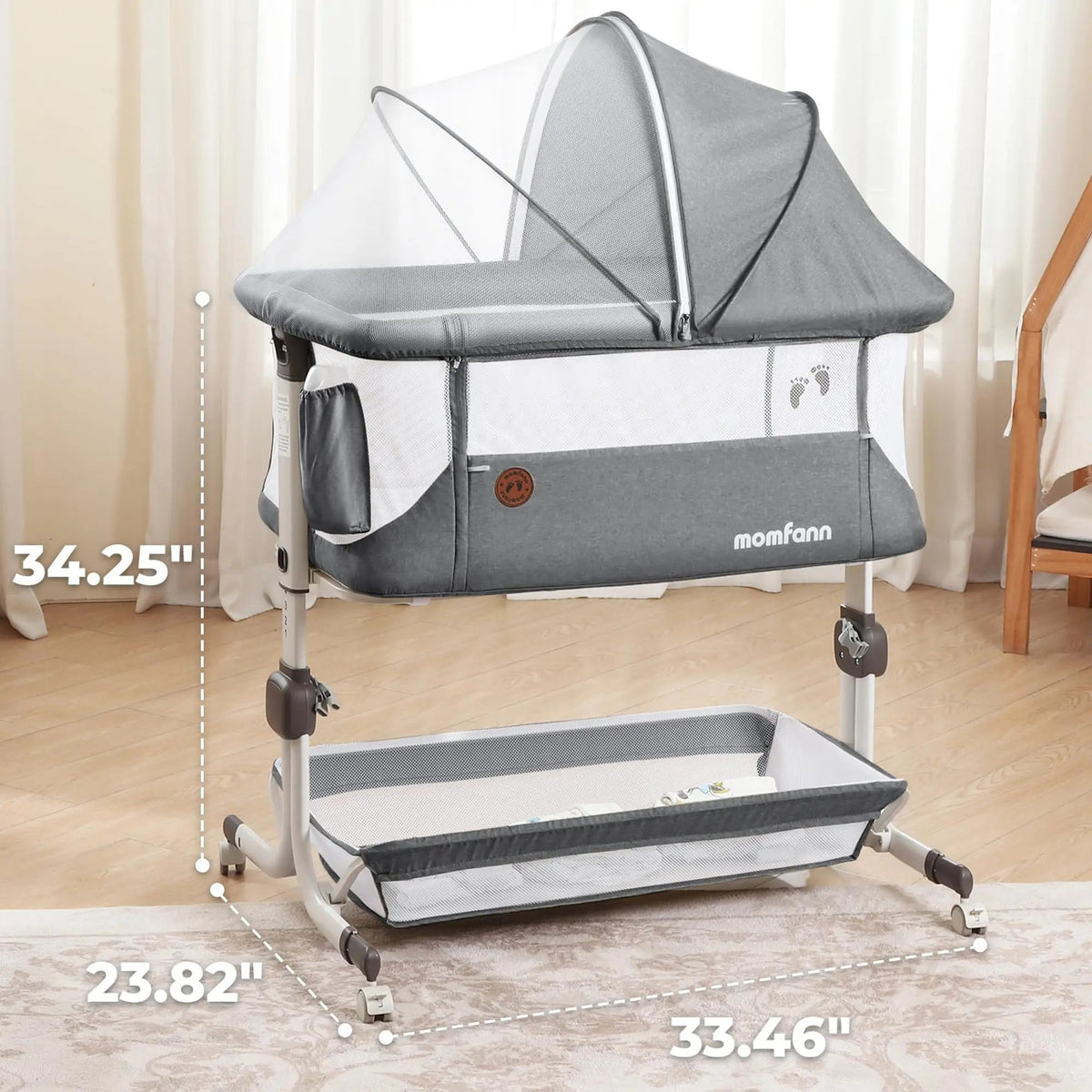 Gray bedside bassinet with mesh canopy and lower storage shelf, shown with dimension callouts.