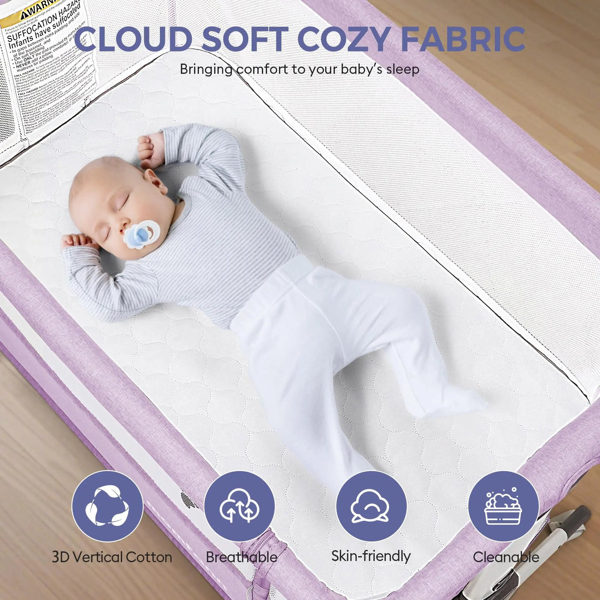 Baby resting in a lavender bedside bassinet with white bedding, under a “Cloud Soft Cozy Fabric” heading.