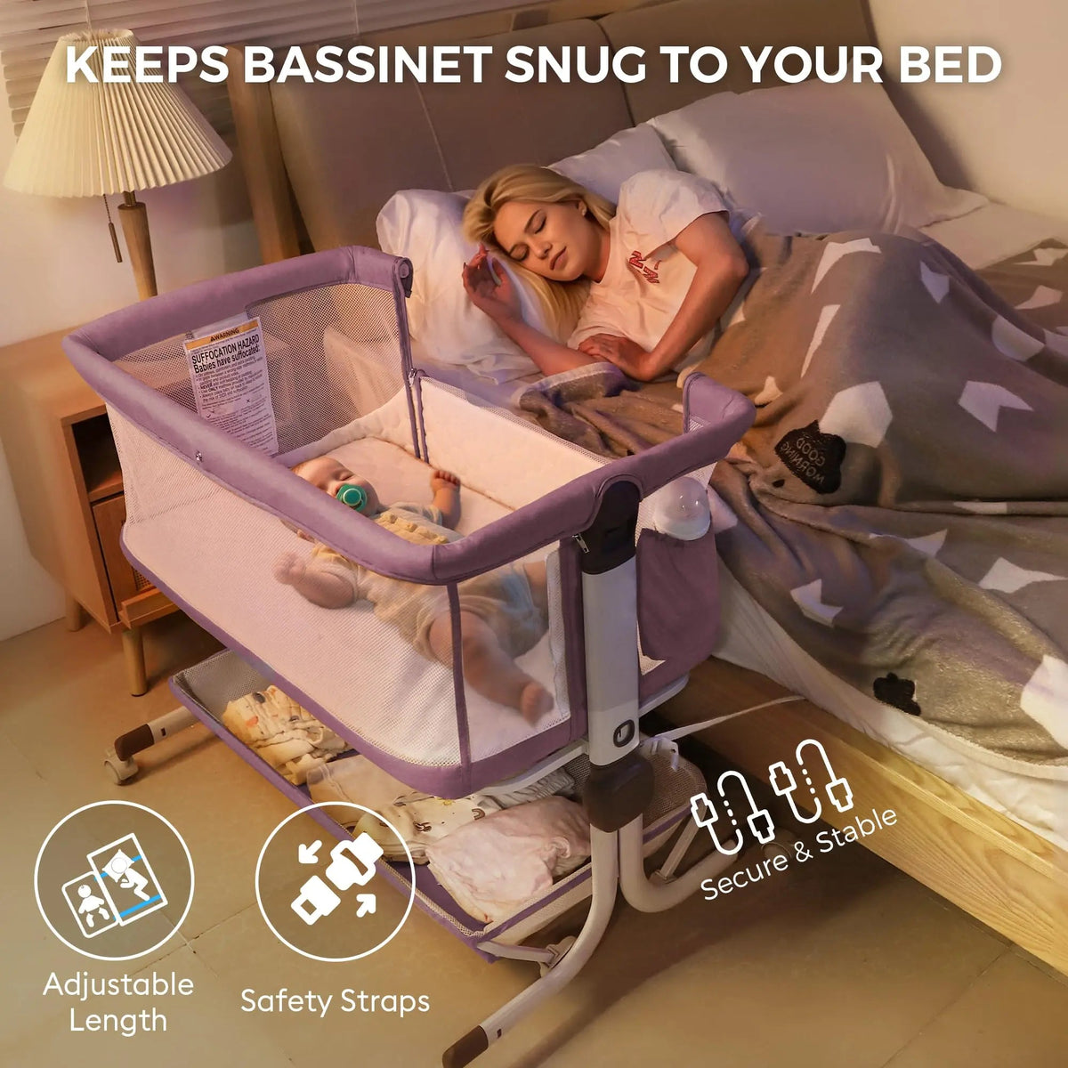 Lavender bedside bassinet next to a bed, with adjustable-length and strap callouts.