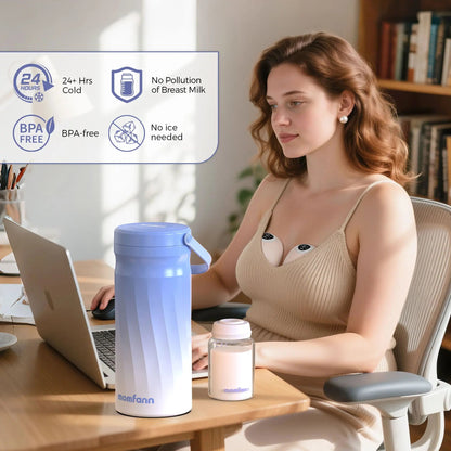 Woman working at a desk beside a blue-and-white breast milk cooler and bottle.