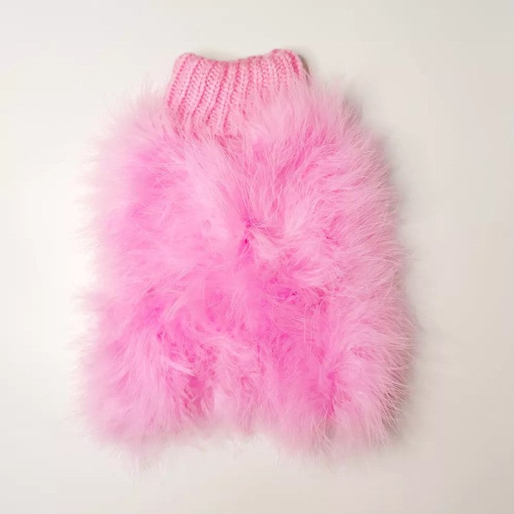 Pink fluffy pet sweater laid flat, showing its knitted turtleneck and textured body
