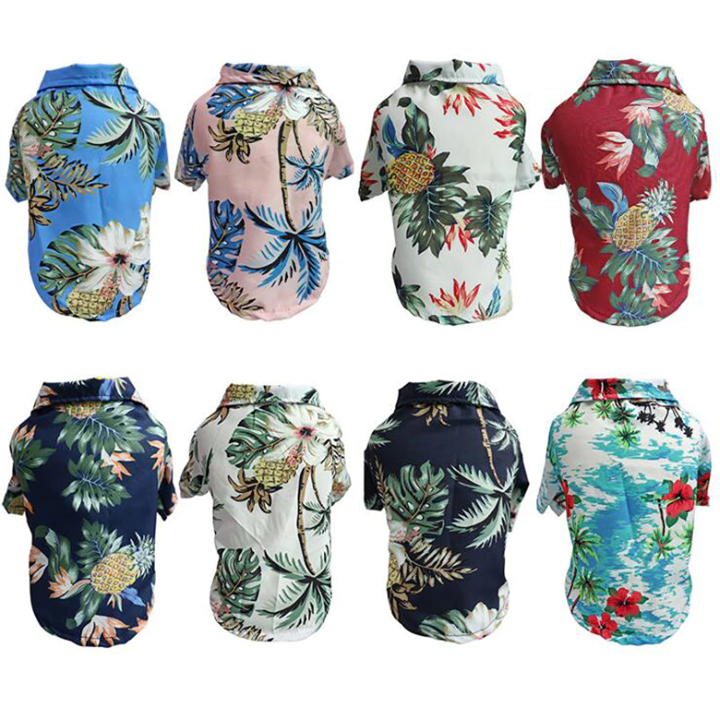 Back views of eight Hawaiian pet shirts with tropical prints