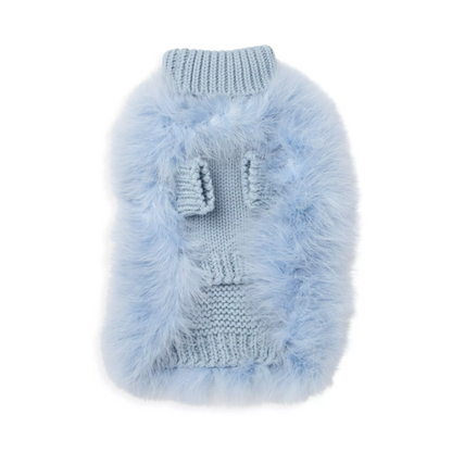 Underside of a blue fluffy pet sweater, showing two knitted sleeve openings and a ribbed hem