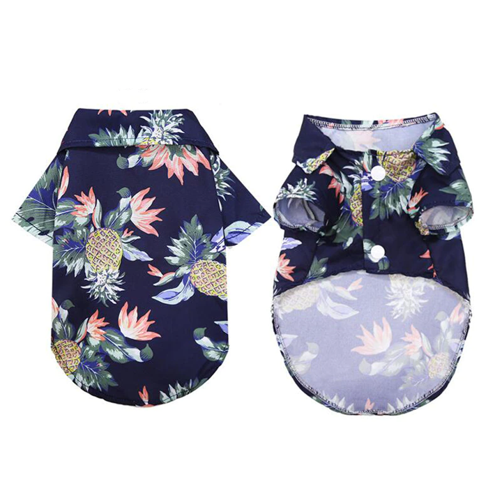 Front and back views of a navy tropical pet shirt with white snap closures