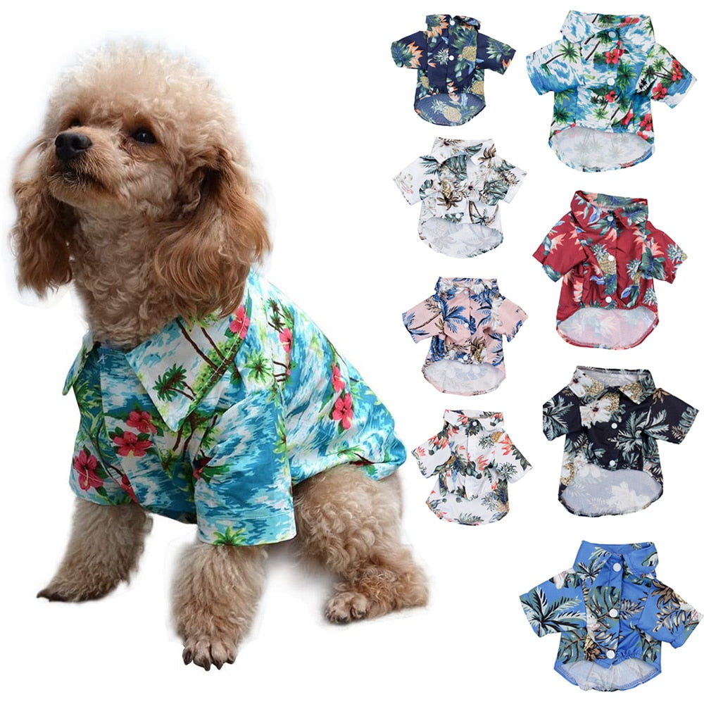 Dog wearing a blue tropical pet shirt alongside eight Hawaiian shirt designs