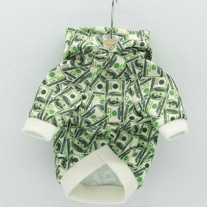 Money print dog hoodie on a hanger showing the dollar bill pattern and white trim
